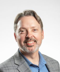 Professional headshot of Dustin DeMoss, DO, MS, FAPA, FACLP